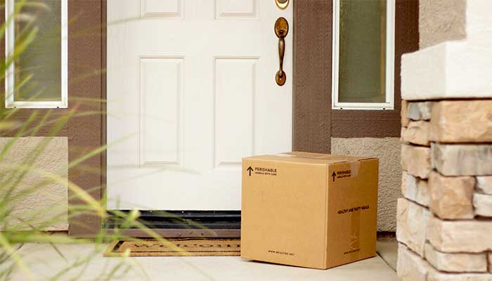 Parcel delivered and left at front door of house.